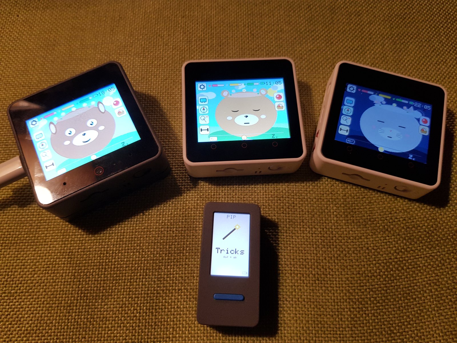 Pixel Pets family on a desk — Muffin, two Goo-Goos and a Pip